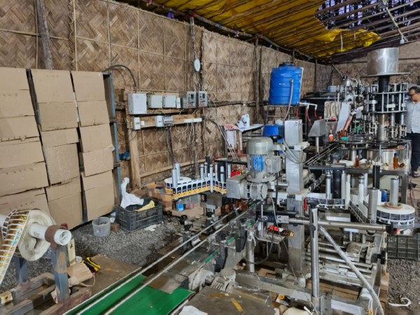 Assam-Meghalaya excise teams bust illegal liquor unit in Meghalaya, seize large quantity of liquor, equipment